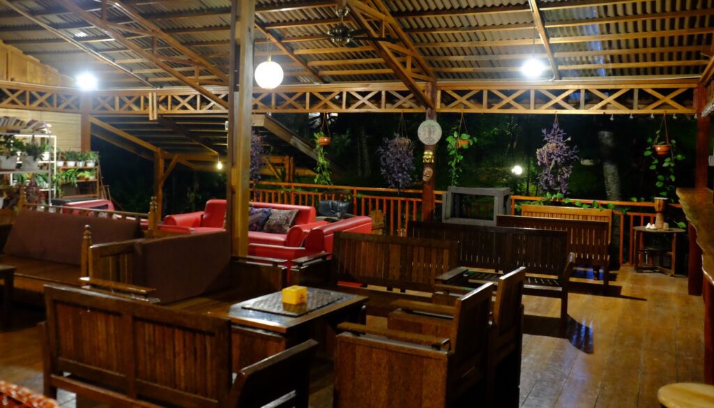 the flowery and wooden second floor restaurant at airmanis hillside retreat padang west sumatra