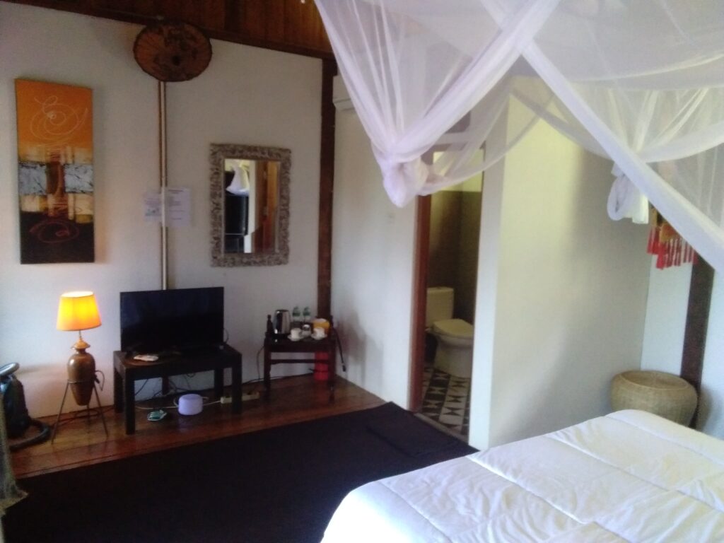 the double deluxe rooms in the wooden double storey main house at airmanis hillside retreat padang west sumatra