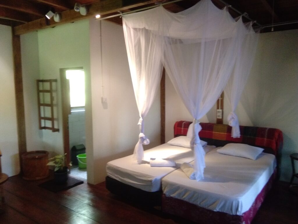 the double deluxe rooms in the wooden double storey main house at airmanis hillside retreat padang west sumatra